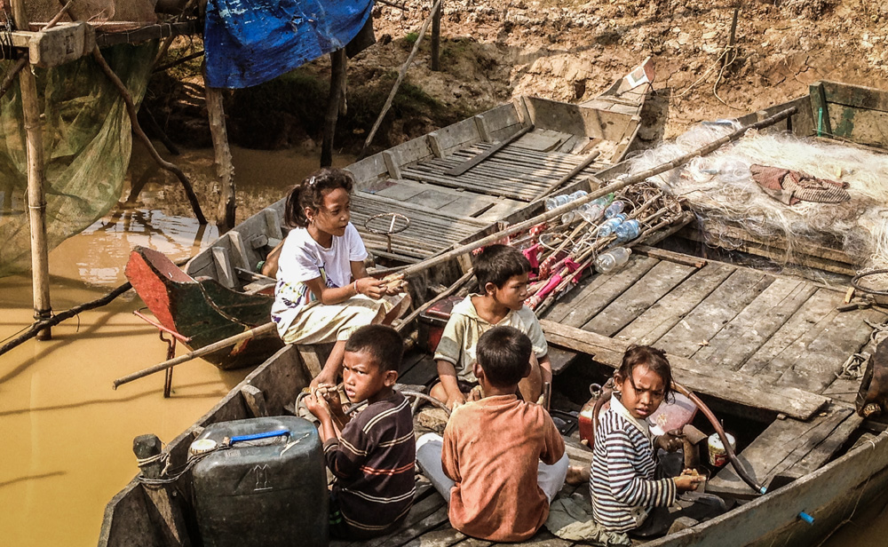 Children tonle sap floating village cambodia